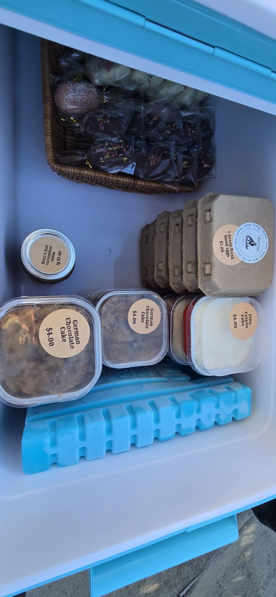 Blue cooler at Monticello Ranch farm stand for items that need shade