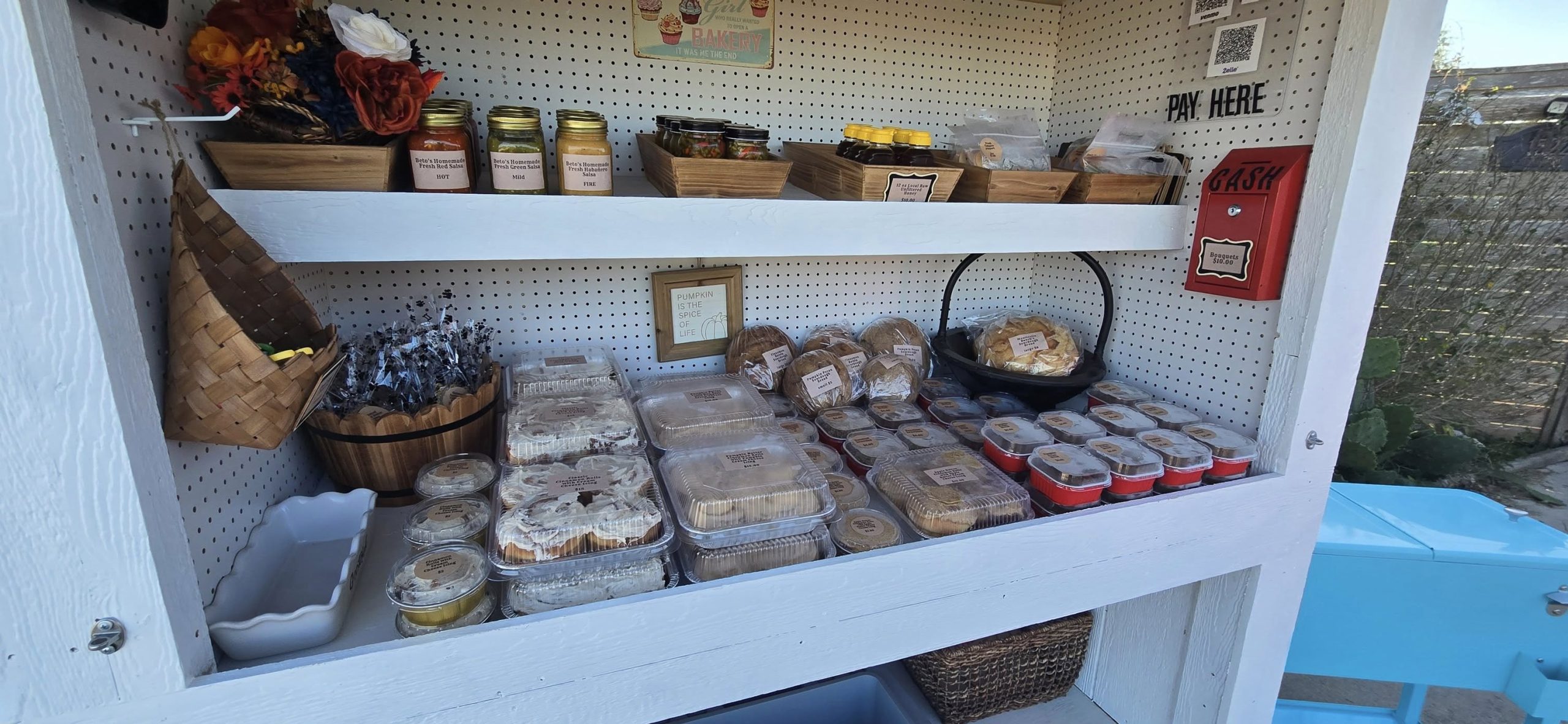 Monticello Ranch farm stand setup with baked goods and signage